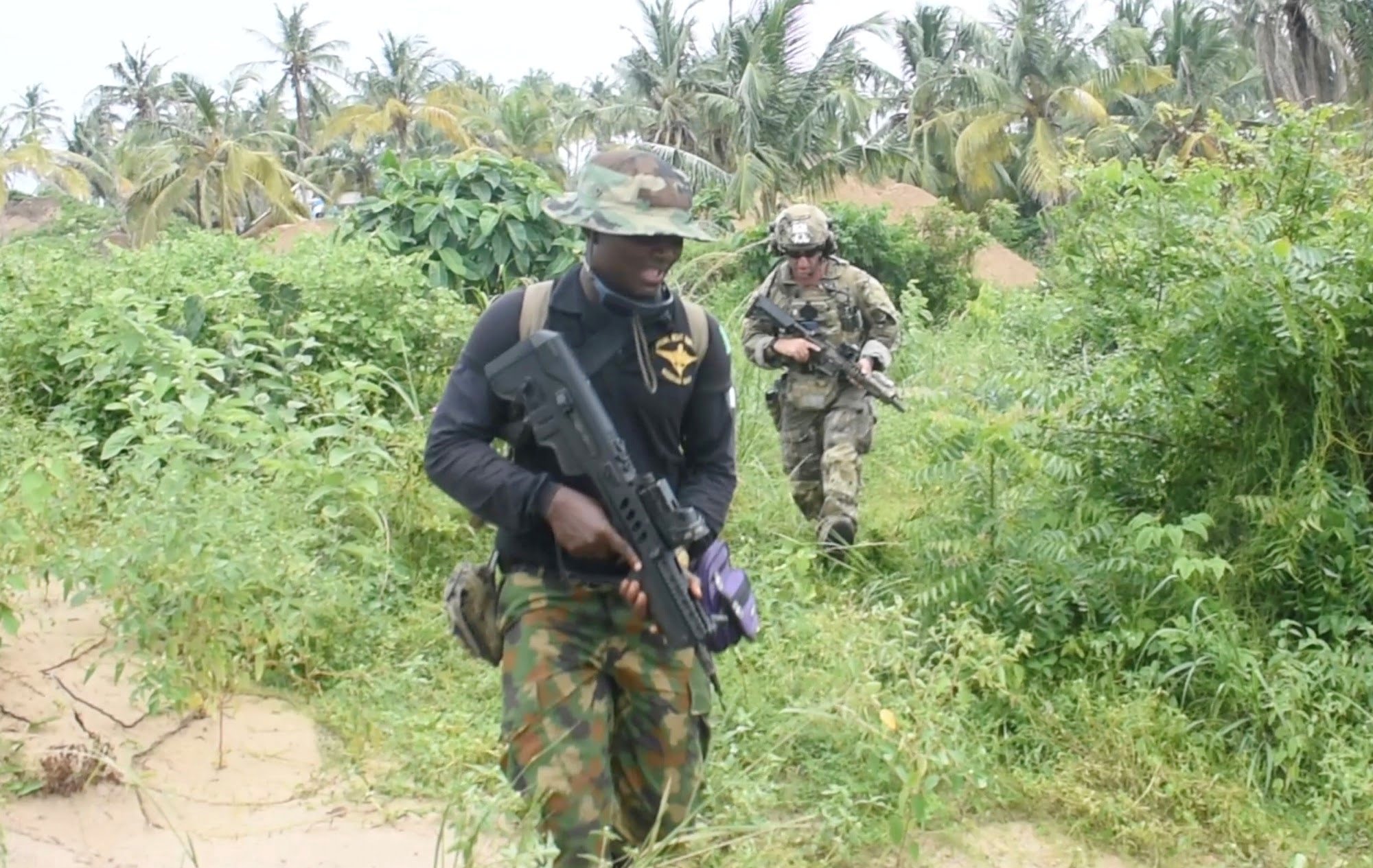 An officer of the Nigerian Navy Special Boat Service left during the five week Joint Combined Exchange Training JCET alongside a team of U.S. Army Special Forces.jpg